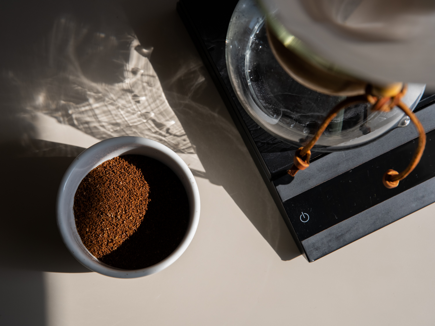 https://thecoffeehopper.com/wp-content/uploads/2023/06/coffee-grounds-cup.jpg